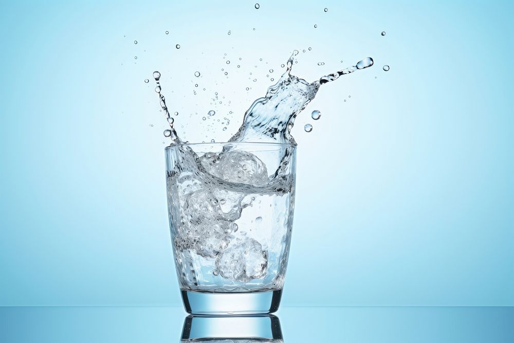 Glass splashing drink water. 