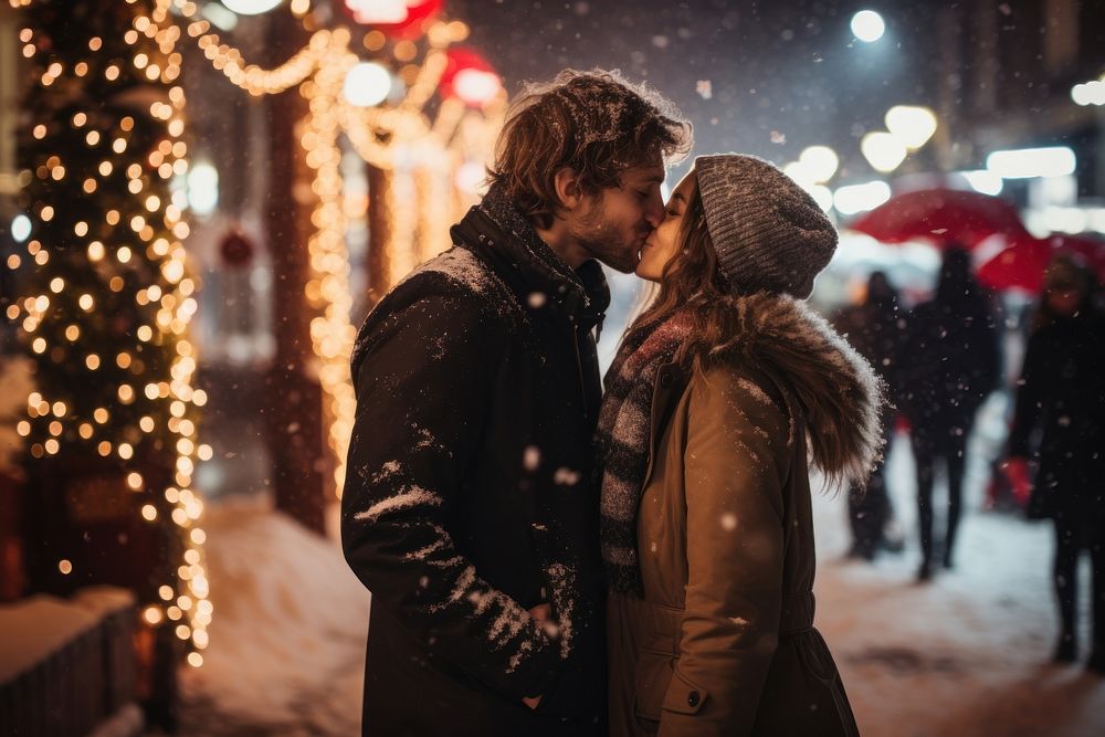 Snow christmas outdoors kissing. 