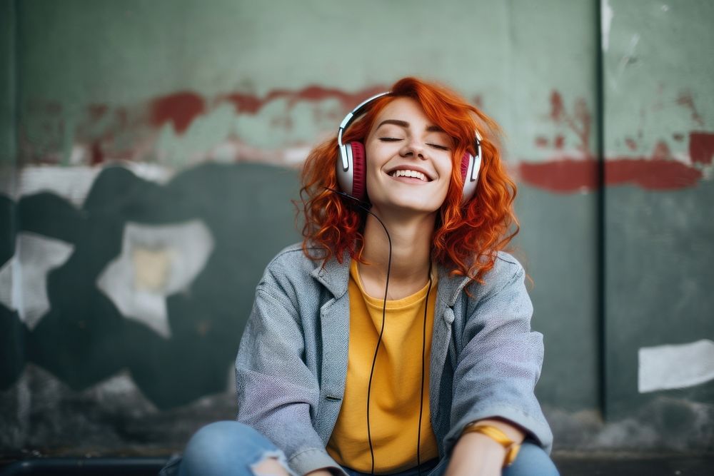 Electronics headphones laughing outdoors. 