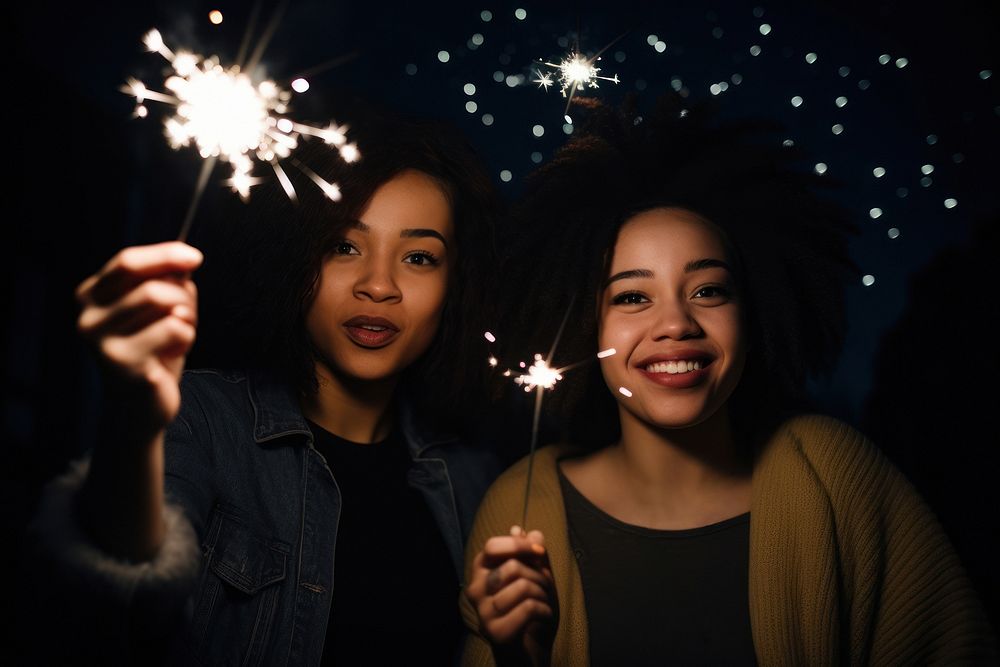 Sparkler sparks adult women. AI generated Image by rawpixel.
