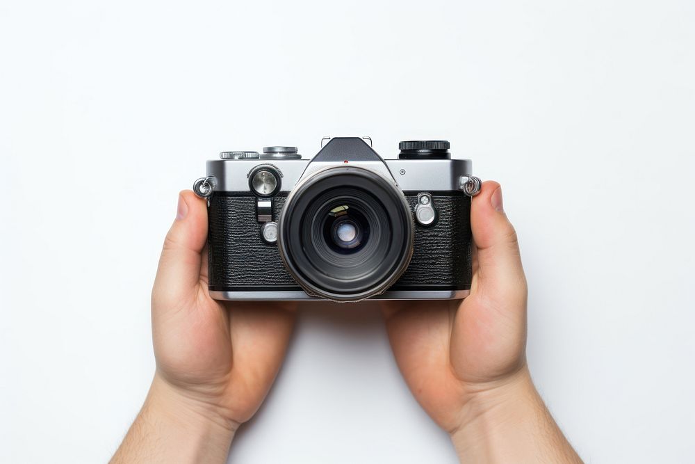 Camera holding photo hand. AI generated Image by rawpixel.