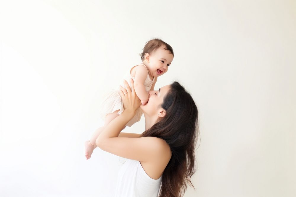 Baby portrait hugging adult. 