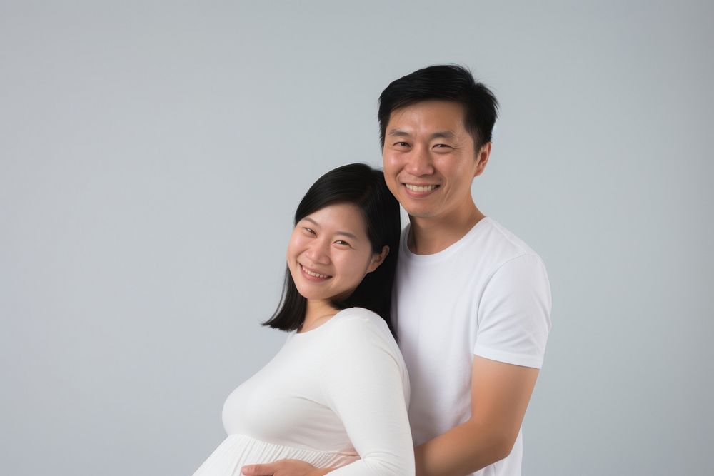 Pregnant portrait smiling family. AI generated Image by rawpixel.