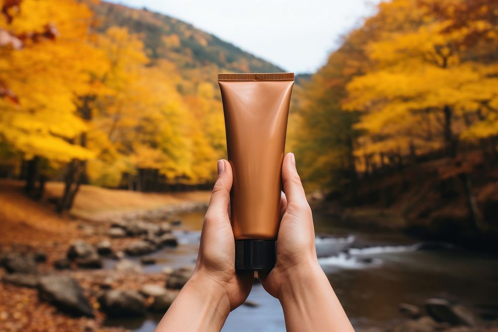 Autumn cosmetics holding photo. AI generated Image by rawpixel.