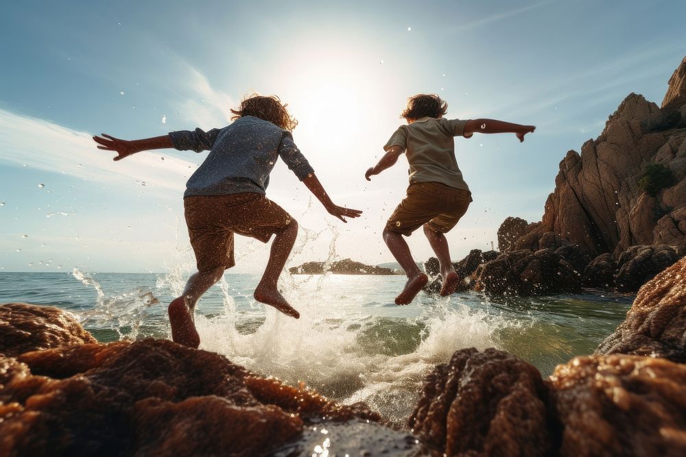 Jumping rock sea outdoors. AI generated Image by rawpixel.