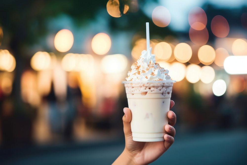 Outdoors dessert holding sundae. AI generated Image by rawpixel.