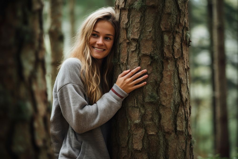 Holding forest tree girl. 