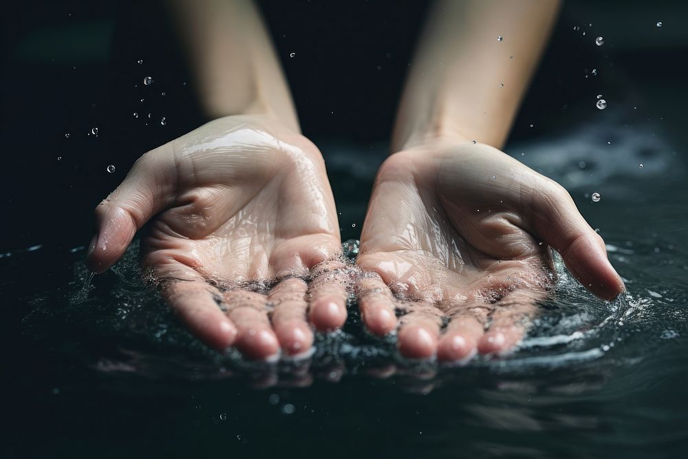 Hand finger splashing barefoot. 