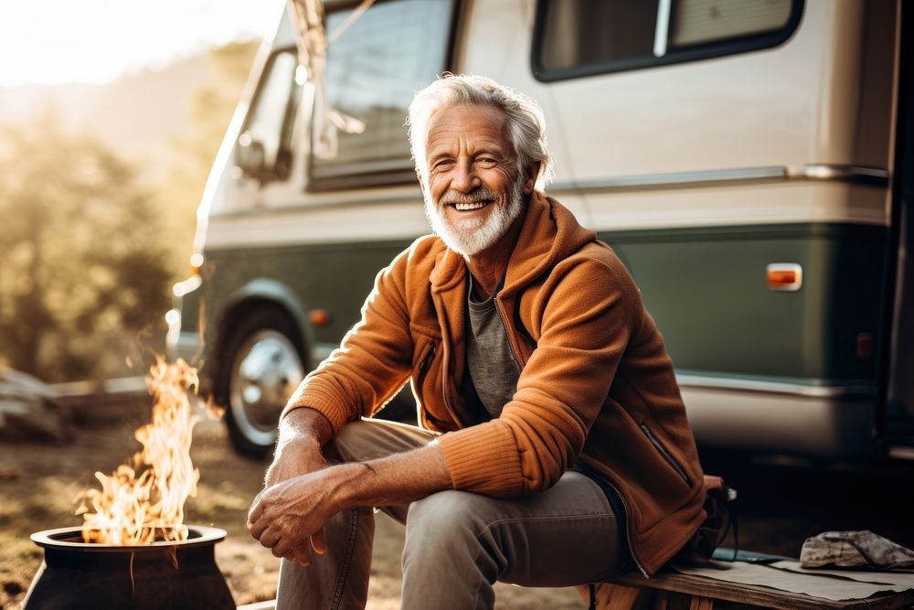 Sitting camping adult fire. AI generated Image by rawpixel.