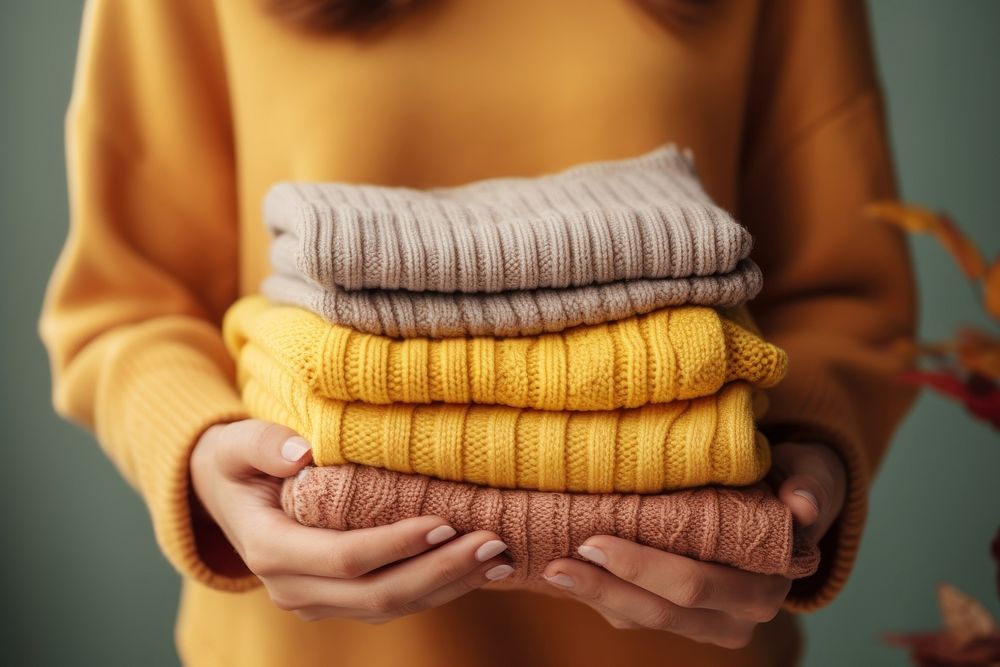 Sweater holding accessories midsection. AI generated Image by rawpixel.
