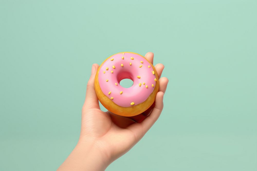 Donut holding food hand. 