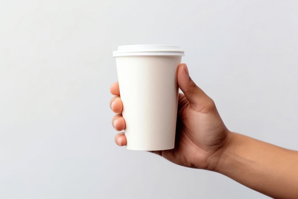 Coffee cup disposable hand. AI generated Image by rawpixel.