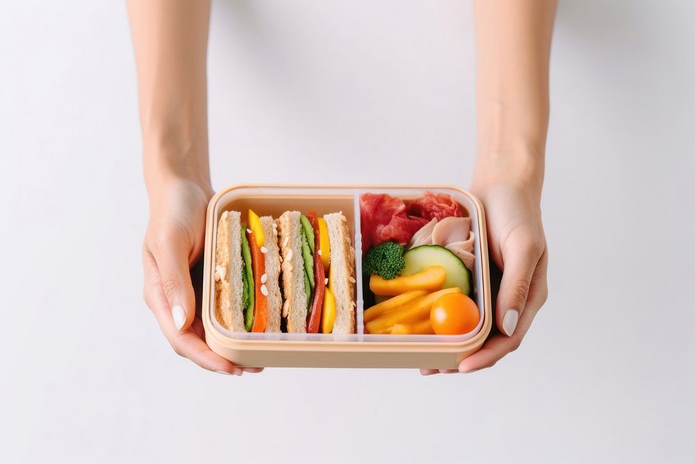 Lunch food box holding. AI generated Image by rawpixel.