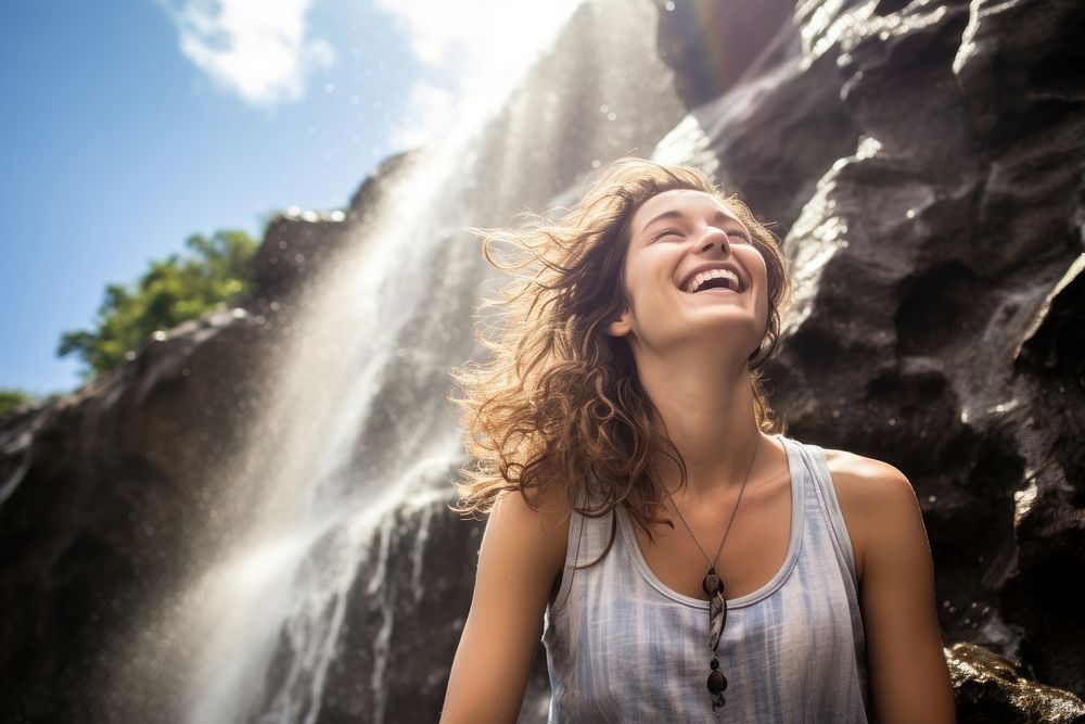 Waterfall laughing outdoors smiling. AI generated Image by rawpixel.