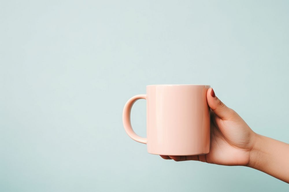 Cup mug holding coffee. AI generated Image by rawpixel.