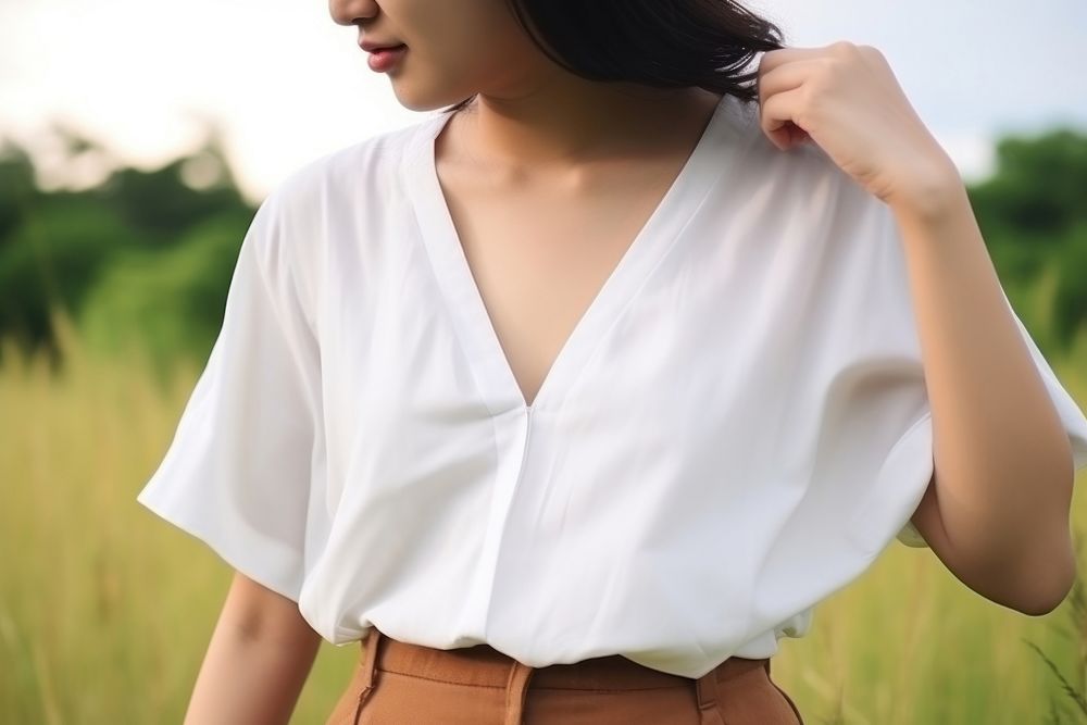 Blouse outdoors sleeve contemplation. 