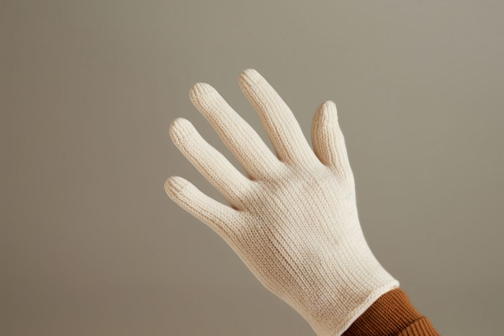Glove white clothing knitwear. AI generated Image by rawpixel.