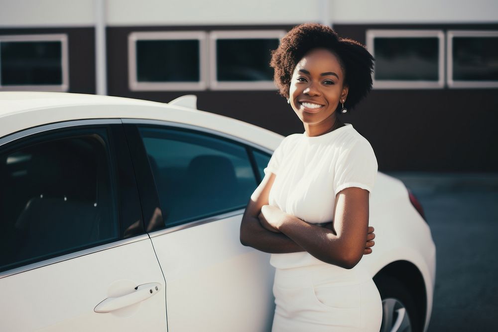 Woman standing by her car. 