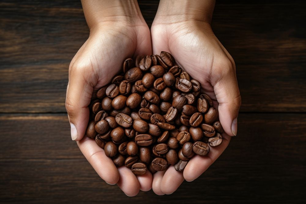 Coffee hand coffee beans refreshment. AI generated Image by rawpixel.