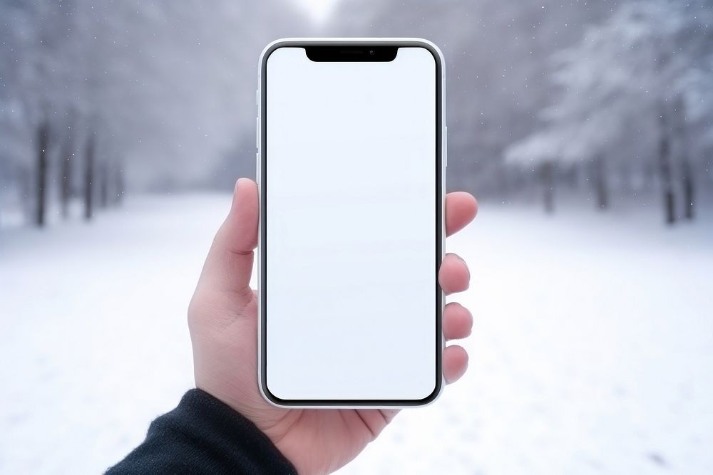 Holding winter white phone. 