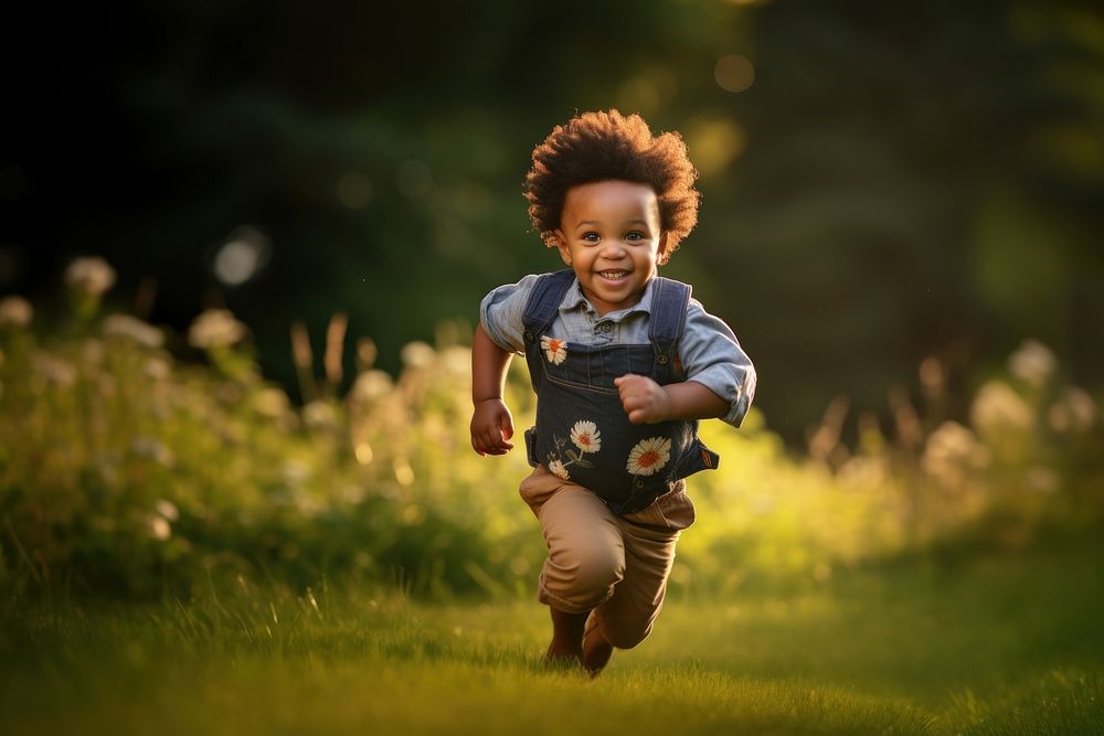 Black male toddler grass portrait outdoors. AI generated Image by rawpixel.