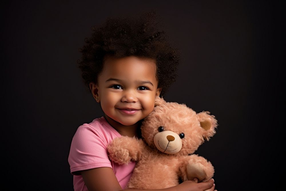 Black male toddler wear pink t-shirt portrait smile photo. 