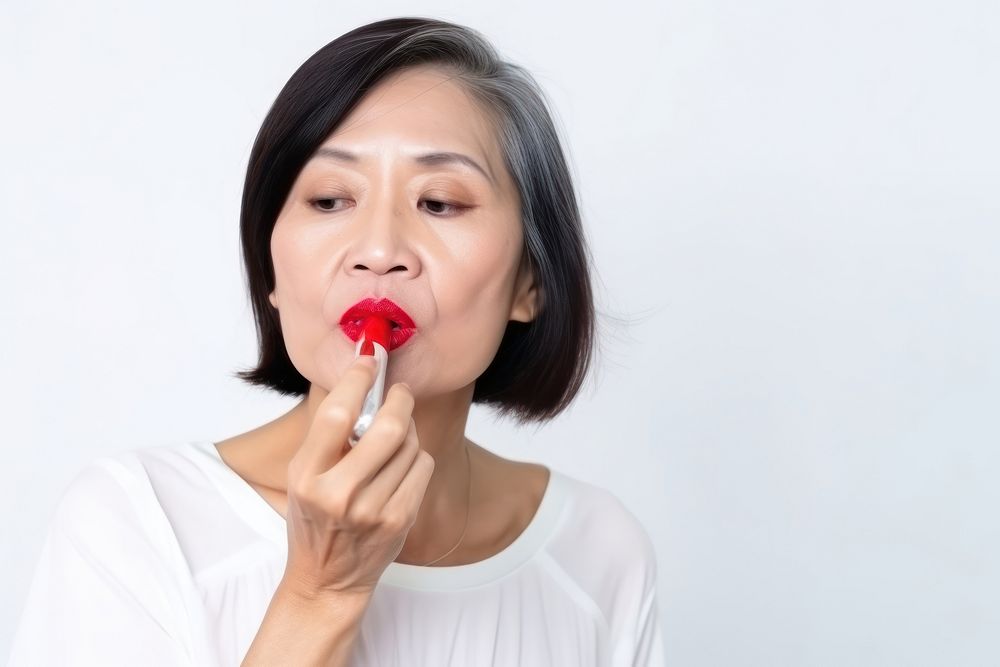 Lipstick applying adult women. AI generated Image by rawpixel.