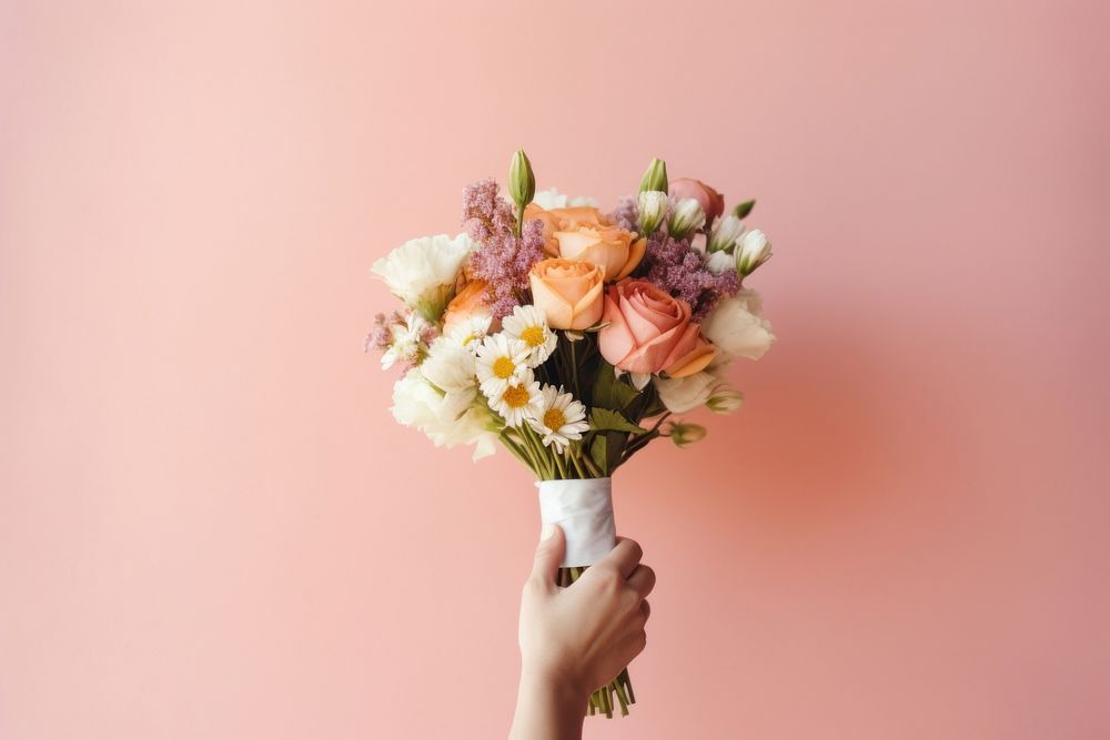 Flower holding plant rose. 