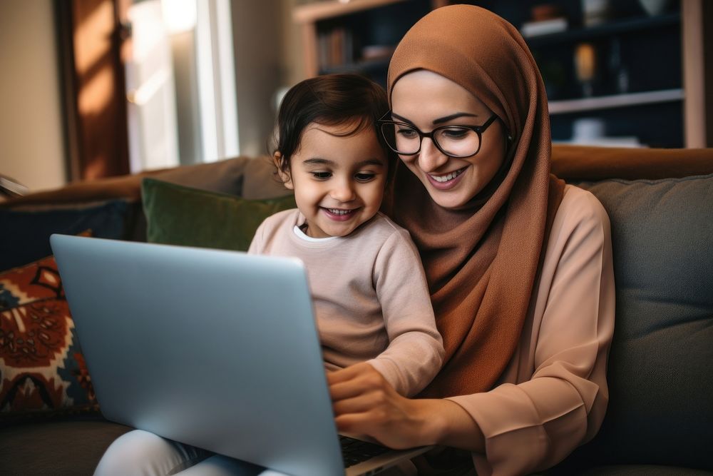 Laptop computer sitting family. AI generated Image by rawpixel.