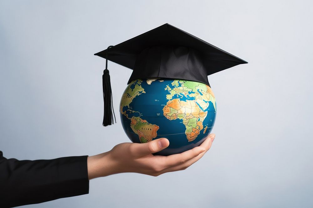 Graduation globe holding planet. 