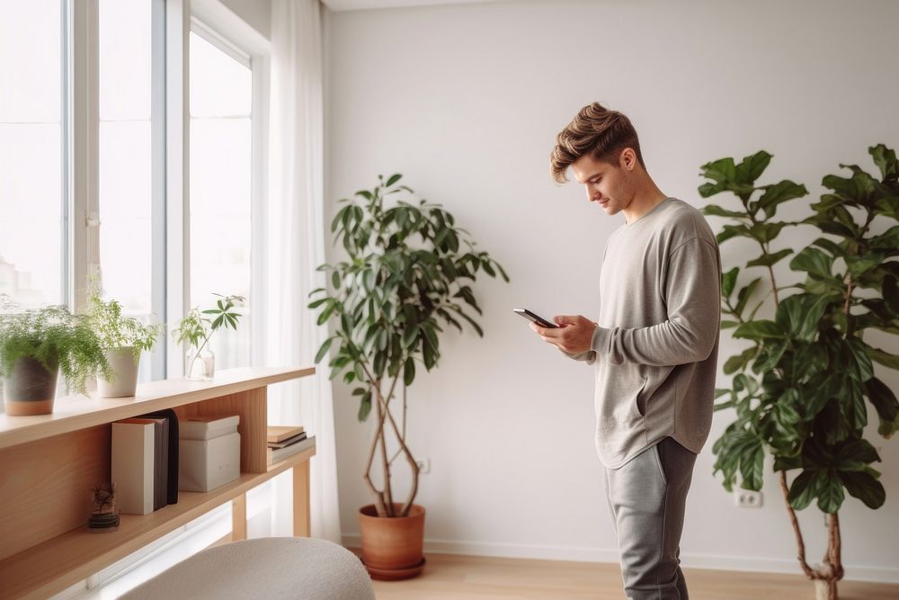 Windowsill adult plant phone. AI generated Image by rawpixel.