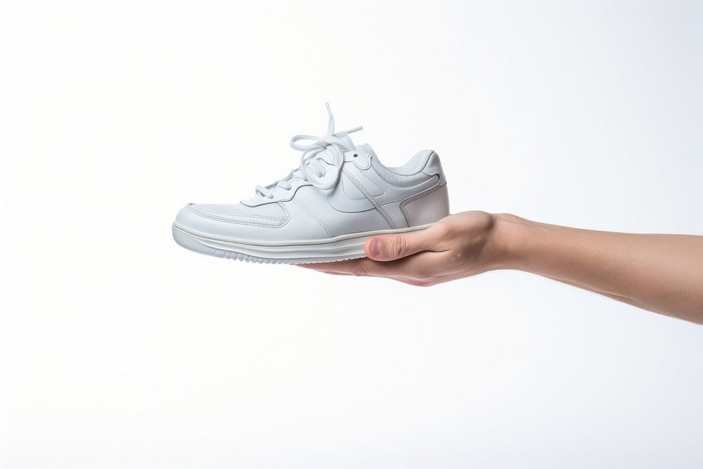 Shoe footwear holding sneaker. AI generated Image by rawpixel.