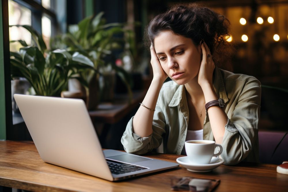 Worried laptop computer sitting. 