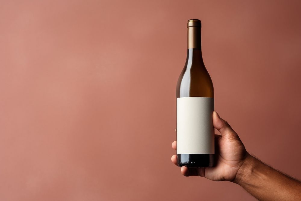 Wine holding bottle drink. AI generated Image by rawpixel.