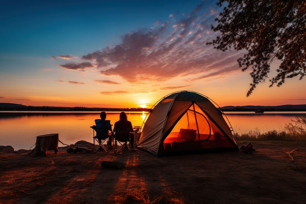 Camping outdoors bonfire sunset. 