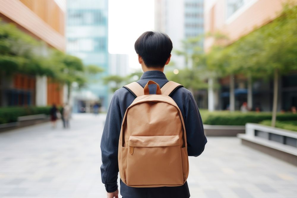 Backpack carrying student walking. 