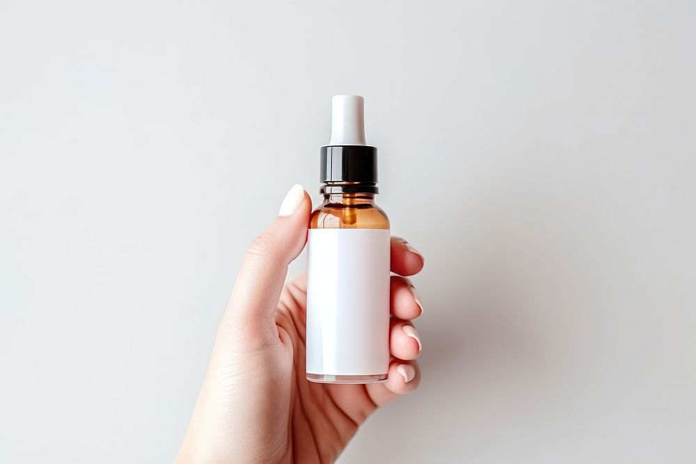 Bottle cosmetics perfume hand. AI generated Image by rawpixel.