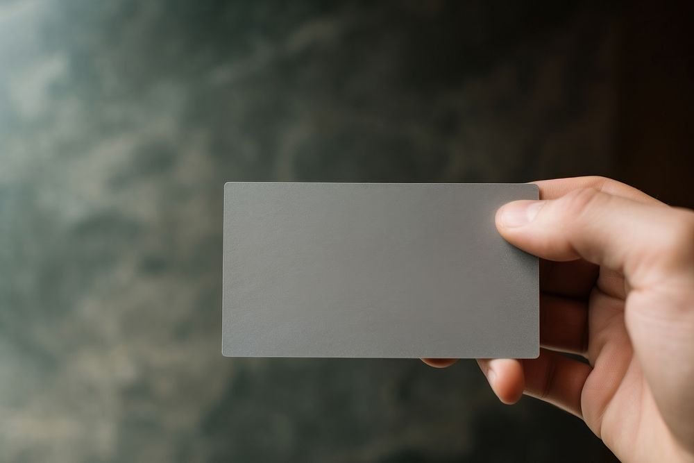Hand business card aluminium holding. AI generated Image by rawpixel.