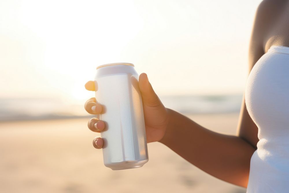 Holding beach drink refreshment. 