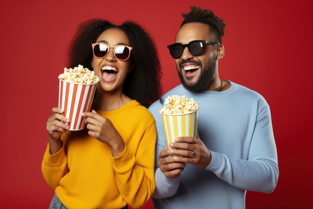 Laughing popcorn glasses togetherness. 