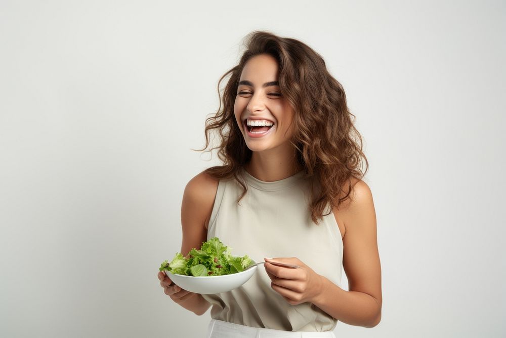 Salad eating laughing adult. AI generated Image by rawpixel.