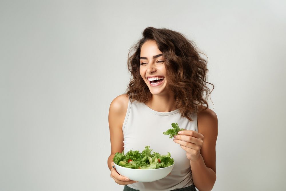 Salad laughing eating adult. AI generated Image by rawpixel.