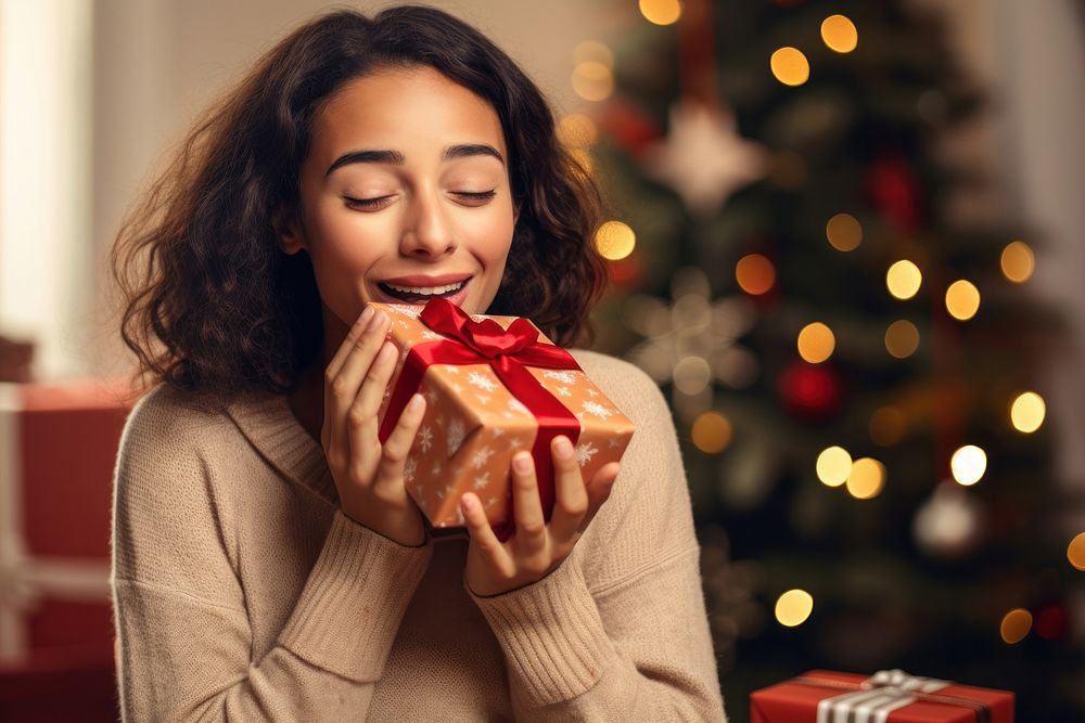 Christmas surprise present holding. AI generated Image by rawpixel.