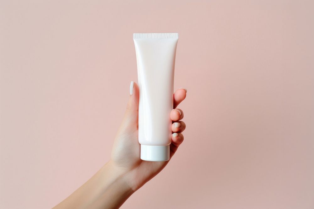 Cosmetics holding toothpaste sunscreen. AI generated Image by rawpixel.