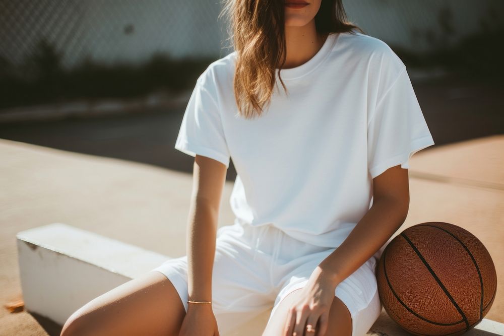 Basketball t-shirt outdoors sitting. AI generated Image by rawpixel.