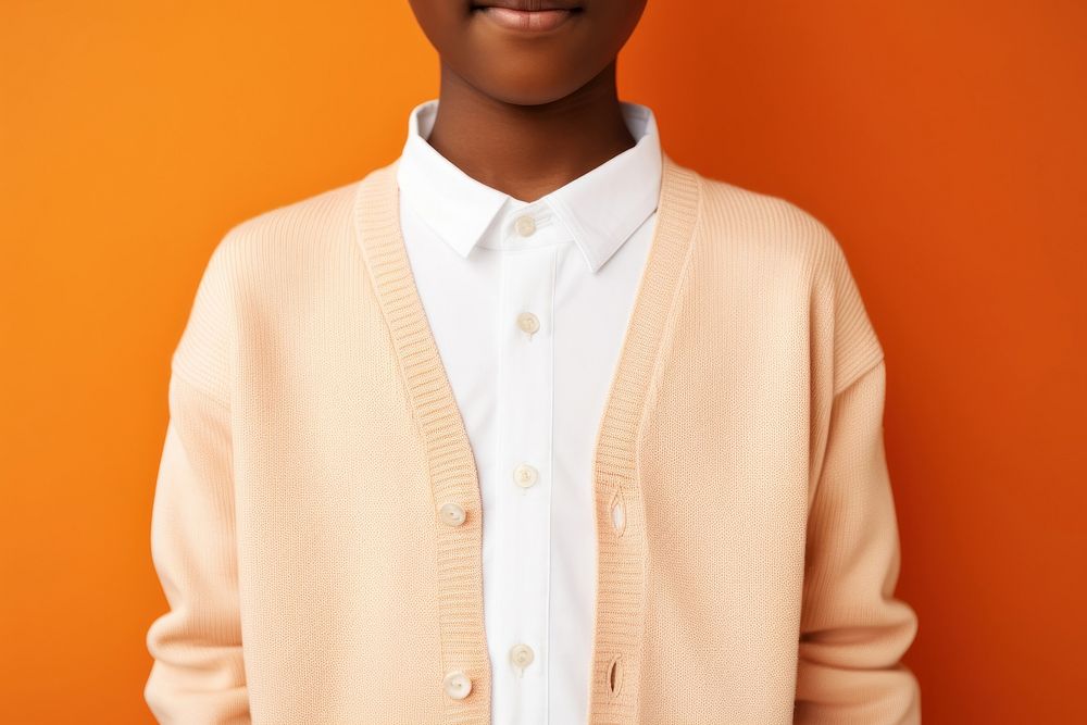 Cardigan sweater orange background sweatshirt. AI generated Image by rawpixel.