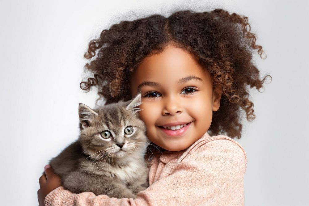 Kitten portrait holding mammal. AI generated Image by rawpixel.