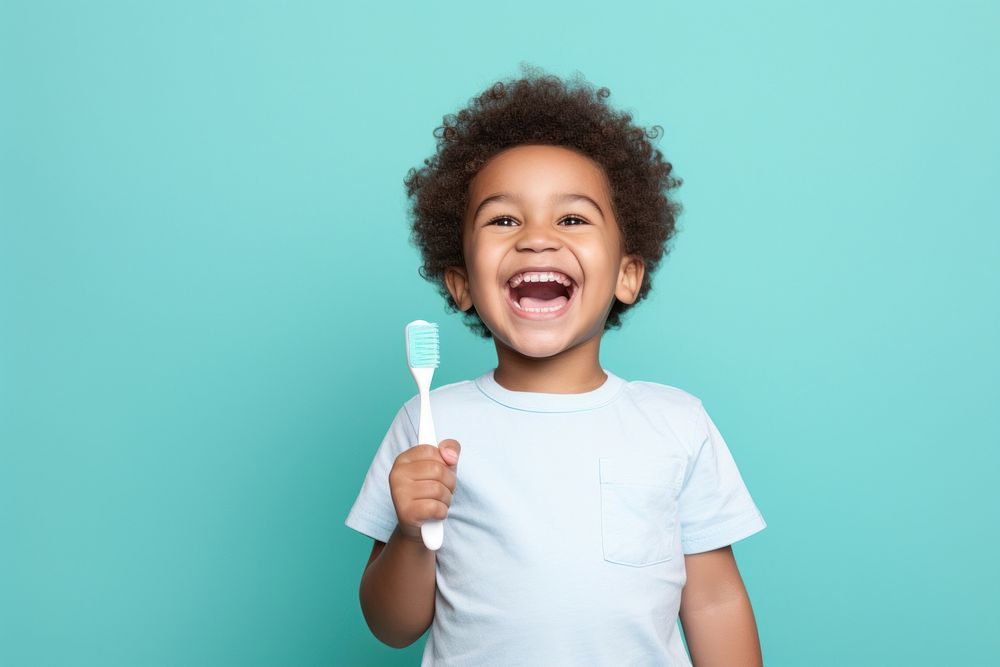 Toothbrush holding happy baby. AI generated Image by rawpixel.
