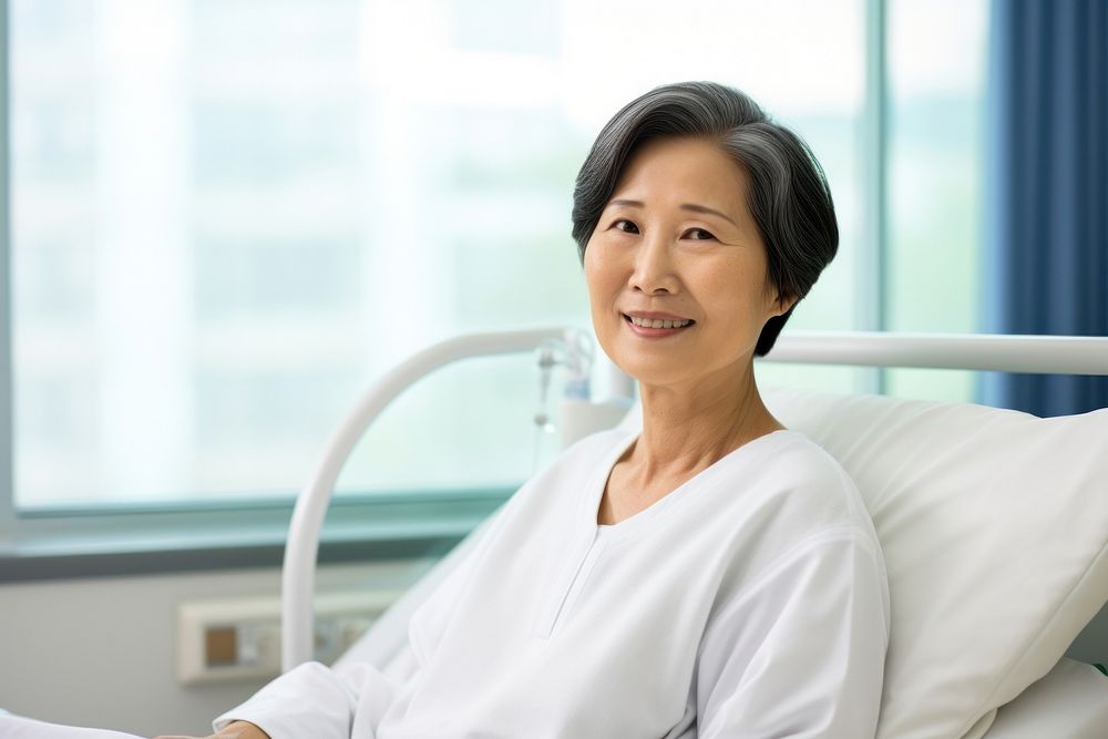 Mature woman patient in hospital gown. AI generated Image by rawpixel.