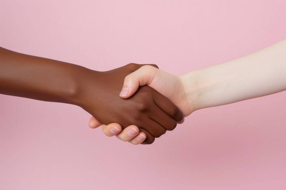 Handshake pink pink background togetherness. 